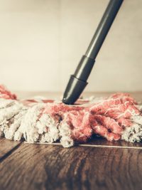 Modern Mop Closeup. Bathroom Floor Cleaning Time.